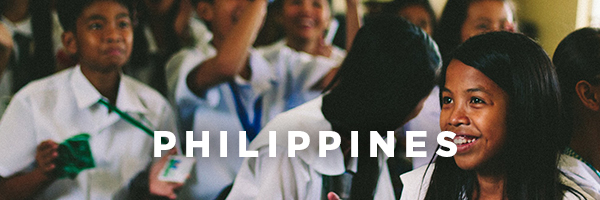 Text saying Phillipenes over a photo of school children smiling