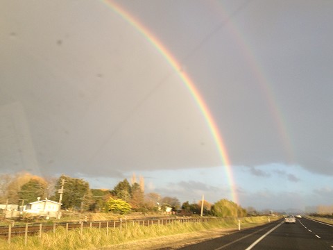 the picture can't do it justice, but here's a shot through the windshield of one of the many gorgeous rainbows we've seen!